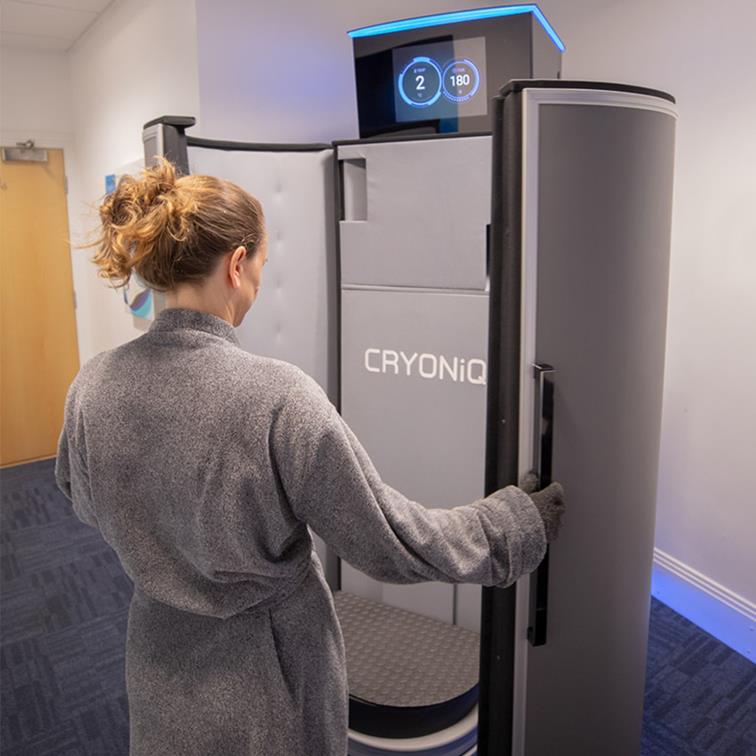 Woman entering Cryo Refresh Wholebody Cryotherapy Chamber